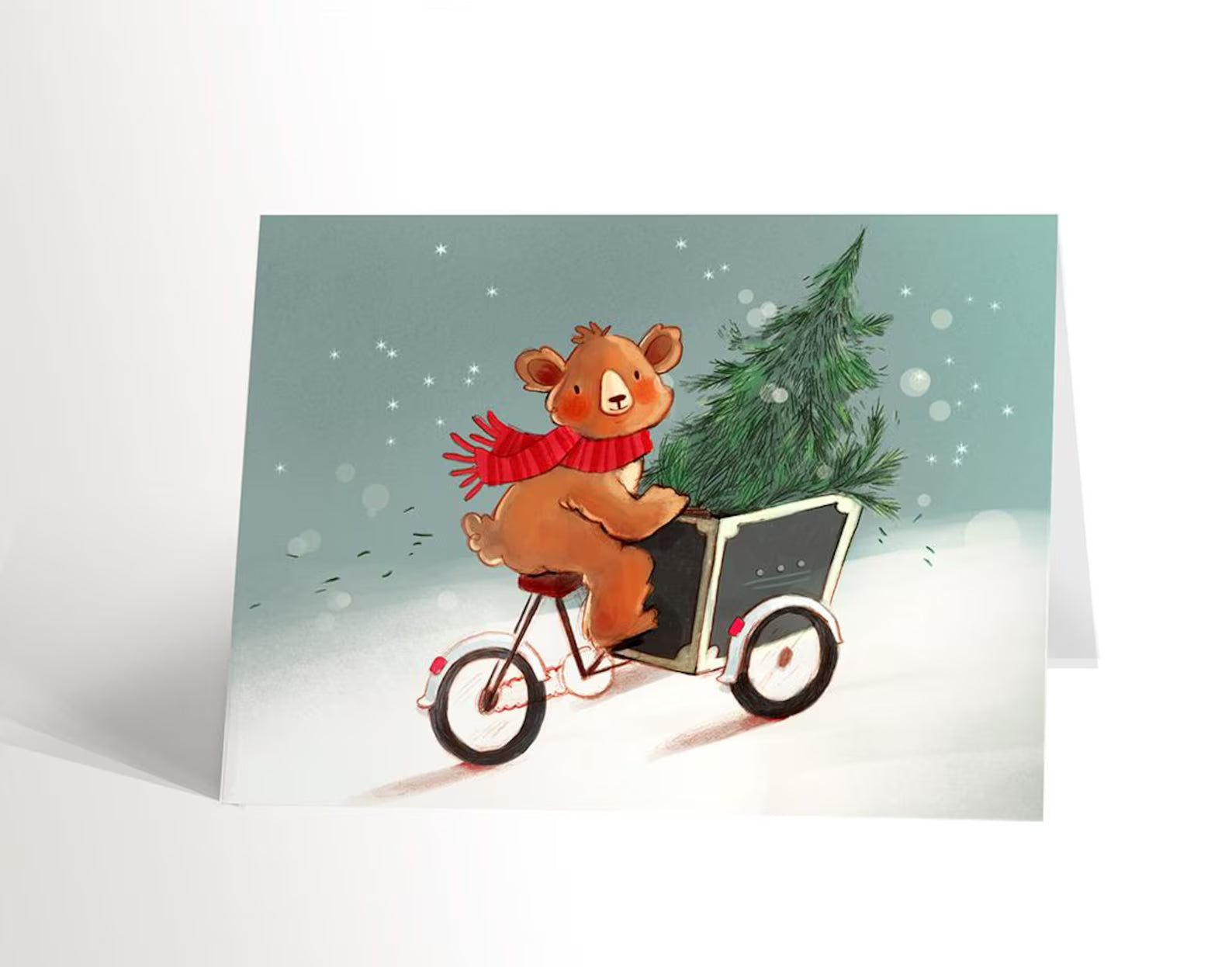 Carte de Noël ourson qui transporte un sapin de Noël à vélo - Valérie Boivin Illustrations